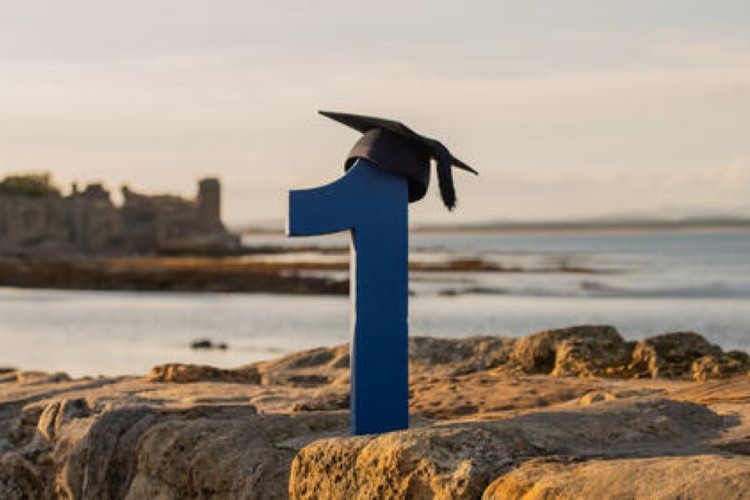 A number wearing a mortar board